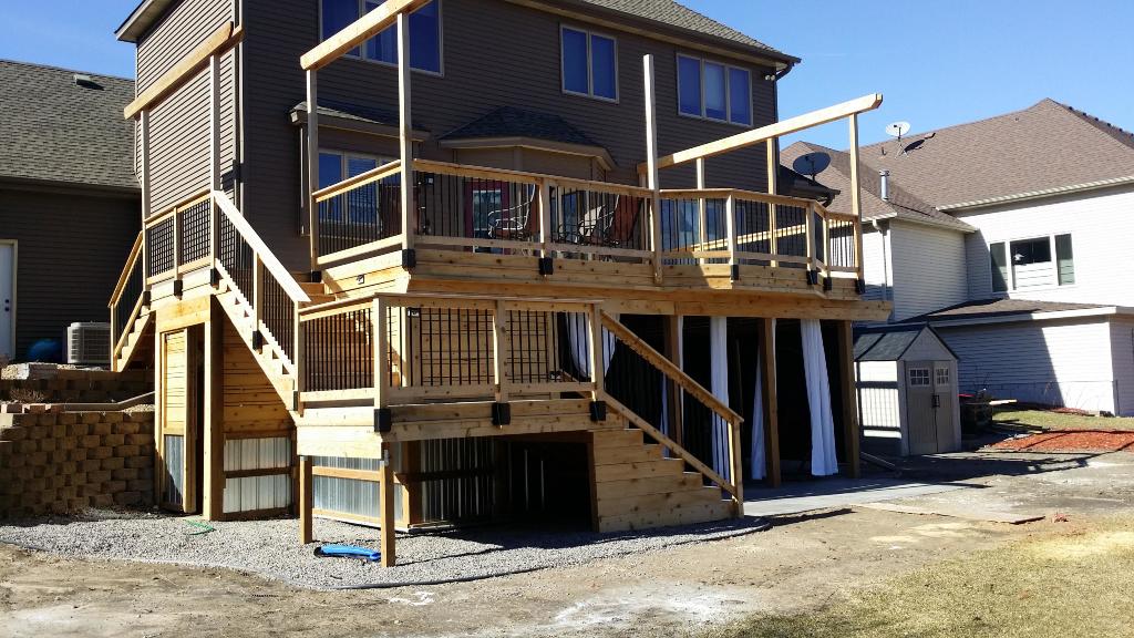 New deck with paver patio and under deck system by Outdoor Den