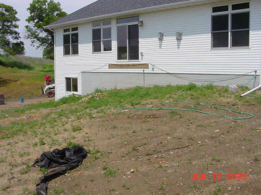 Before - Walls and Raised Back Patio | retaining walls and pavers